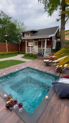 a small pool in the middle of a wooden deck
