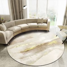 a living room with a large round rug on the floor