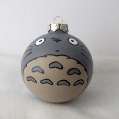 a ceramic ornament shaped like a totoro