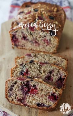 a loaf of mixed berry banana bread on top of a cutting board with the words mixed berry