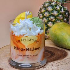 Introducing the new and delicious Mango Madness Dessert Candle! This delightful wax candle will be the perfect addition to any space, as it is sure to fill the air with a pleasant and sweet mango scent.With a unique blend of all-natural ingredients, this candle is just as beautiful as it is fragrant. Each candle is carefully crafted with pure soy wax and a tropical blend of delicious mango giving it an incredibly luxurious aroma. When lit, the mango scent is sure to transport you to a tropical p Desserts, Mac, Fruity Scented Candles, Soy Wax, Aroma Candle, Dessert Candles
