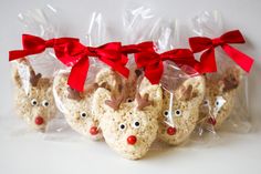 five reindeer cookies wrapped in cellophane and tied with red bows