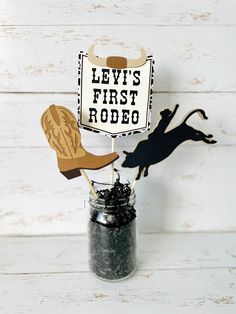 "These rodeo centerpieces will be a great addition to your western, my first rodeo or cowboy/cowgirl birthday decor! ** Pint Size Mason Jar and shredded paper NOT included** **Check shop of other rodeo party decorations. Banner, cake topper and photo banner not included.  Centerpiece Details: » One set comes with 3 picks (as shown in picture) » Center pick is customizable. Please note in personalization box what wording or age you would like. » Wording is made of cardstock not printed » Center p
