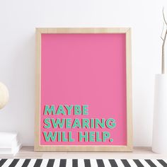 a pink poster with the words maybe swaring will help on it next to a black and white striped rug