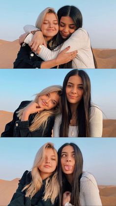 two girls hugging each other in the desert with sand dunes and blue sky behind them