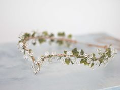 a close up of a flower crown on a table