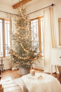a white christmas tree in a living room