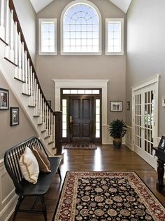 Traditional Entryway with High ceiling, Hardwood floors, Transom window, specialty door Foyer Decorating, Interior, French Doors, Foyer Paint Colors, Foyer Colors, Entry Foyer, Foyer Paint, Foyer Furniture