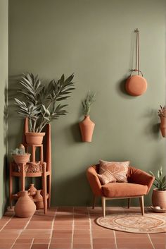 a living room with potted plants on the wall and an orange chair next to it