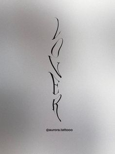 an abstract drawing of the word love in black ink on a white paper with a gray background