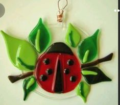 a ladybug ornament hanging on a wall
