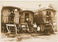 an old black and white photo of people standing in front of train cabooses