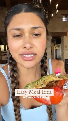 a woman holding up a piece of food in her hand with the words easy meal idea on it