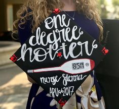 a woman holding a graduation cap that says one degree mother