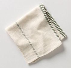 two folded napkins sitting on top of each other