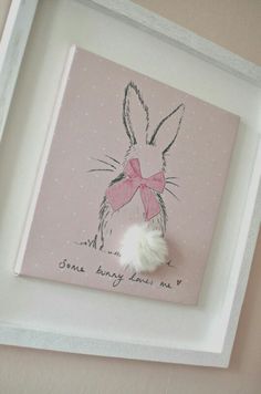 a white frame with a pink bunny on it