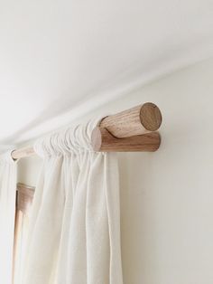 a curtain rod is hanging on the wall