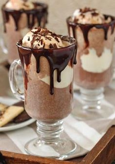 three glasses filled with ice cream and chocolate