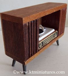 an old fashioned wooden radio with its door open
