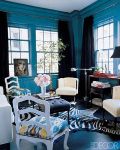 In the living room of Shyama Patel and husband's Gramercy Park duplex, 2010 A-List designer Miles Redd pairs 1940s French club chairs from Aero with midcentury French slipper chairs in silk ikat from John Rosselli International; the RL '67 Boom Arm floor lamp is by Ralph Lauren Home, the vintage Maison Jansen table lamp is from Pavilion Antiques, and the floors are ebonized maple.   - ELLEDecor.com Pastel, Media Room
