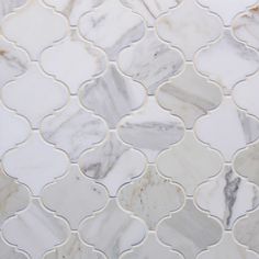 a white marble mosaic tile with an intricate design