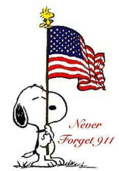 a snoopy holding an american flag on top of his head and standing in the grass