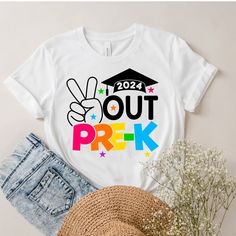 a t - shirt that says out prek on it with a hat and flowers