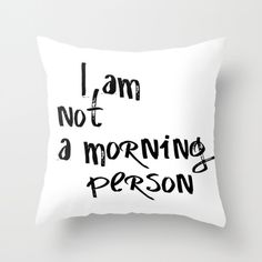 a pillow with the words i am not a morning person printed on it in black and white