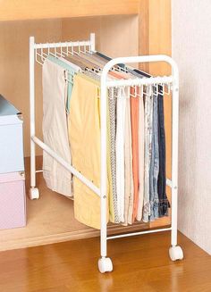 an ironing board with clothes hanging on it