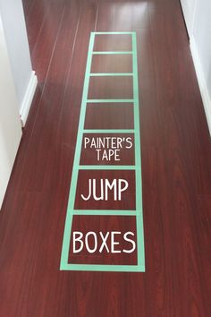 there is a ladder painted on the floor that says paintter's tape jump boxes