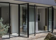 an open room with glass walls and sliding doors
