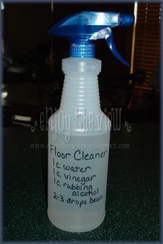 a blue and white spray bottle with writing on it
