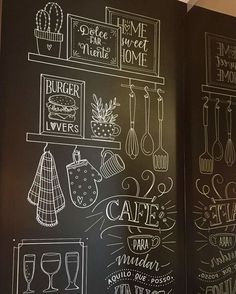 two blackboards with chalk drawings on them in a restaurant or coffee shop, one showing menus and the other depicting different types of food