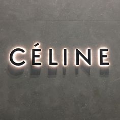 the word celline is lit up in black and white letters on a gray surface