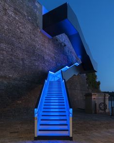 the stairs are lit up with blue lights
