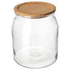 a glass jar with a wooden lid