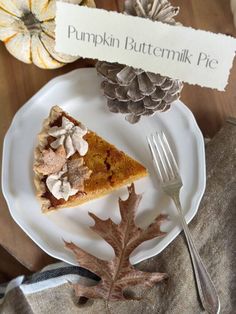a slice of pumpkin buttermilk pie on a plate with a fork and napkin
