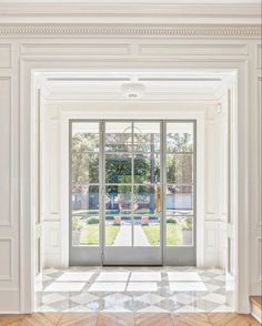 an open door leading into a white room