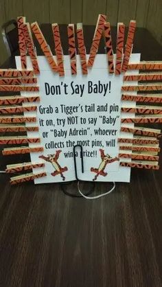 a sign that says don't say baby grab a tiger's tail and pin it on, try not to say baby