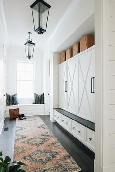 Long cottage mudroom boasts seeded glass carriage lanterns above an orange and blue runner layered over dark stained wood floors. Country, House Plans, Westgate, House Styles, New Homes, Dream House, Foyer, House Interior, Interieur