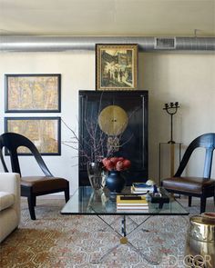 A 1970s Maison Jansen cocktail table and an antique Chinese lacquered cabinet.