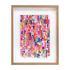 an abstract painting in a wooden frame with multicolored squares on the bottom half