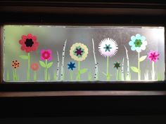 a window with flowers painted on it