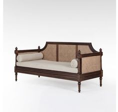 an antique daybed with wicker and canes