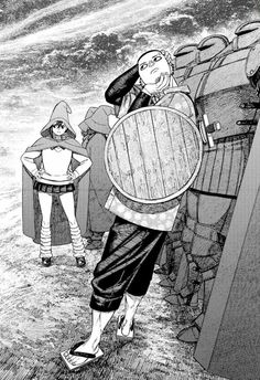 an image of a man holding a barrel in front of another man standing next to him