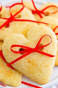 Hearts & Bows Cookies are a super cute way to show someone you love them! These easy-to-make sugar cookies are perfect for Valentine's Day! Brownies, Ideas, Pie, Valentine's Day, Biscuits, Cookie Dough, Valentine Cookies, Heart Shaped Cookies, Sweet Treats