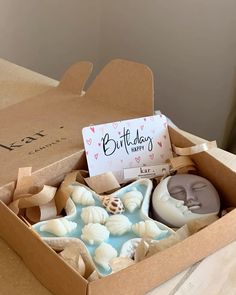 a box filled with lots of different types of soap next to a sign that says birth bliss