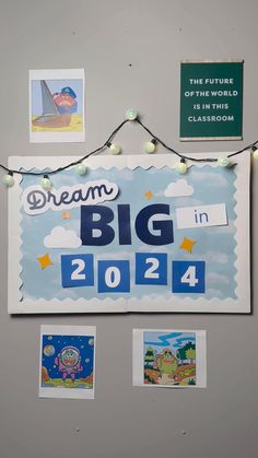 a bulletin board with magnets and pictures on it that says dream big in 2012