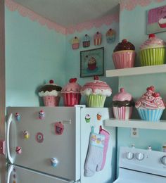a kitchen with cupcakes and other decorations on the shelves above the stove top