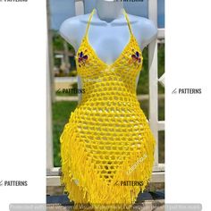 a dress made out of yellow yarn with different patterns on the front and back, as well as instructions for how to sew